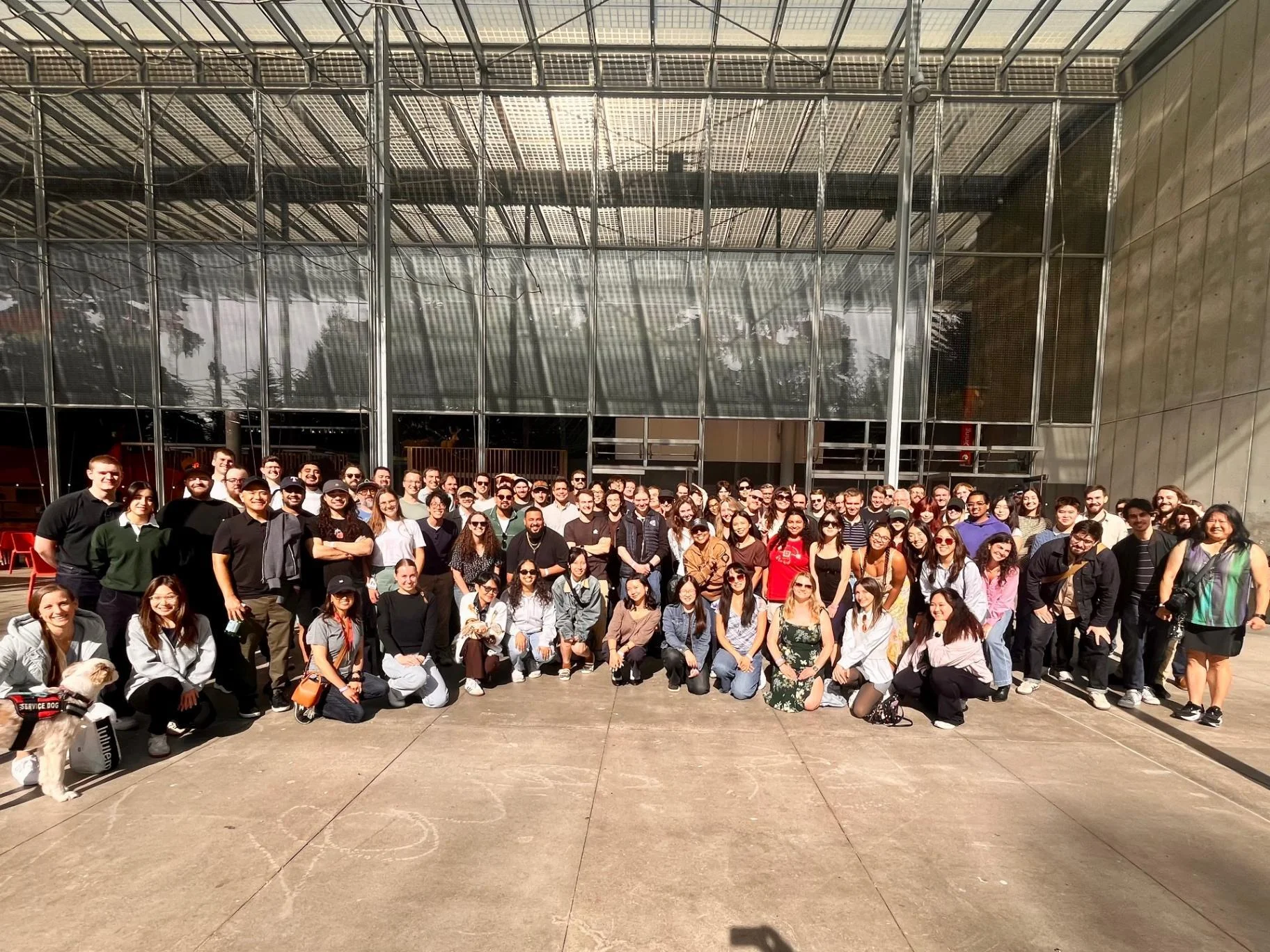The full Notability team gathered together outside a glass-walled building during a company on-site